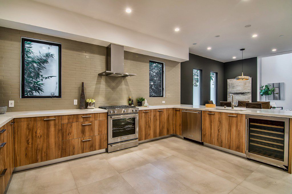Elegant modern kitchen with custom tile backdrop