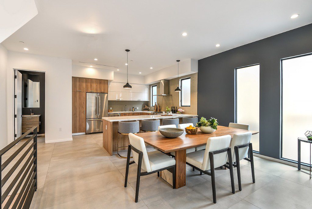 Elegant California kitchen and dining room with accent wall