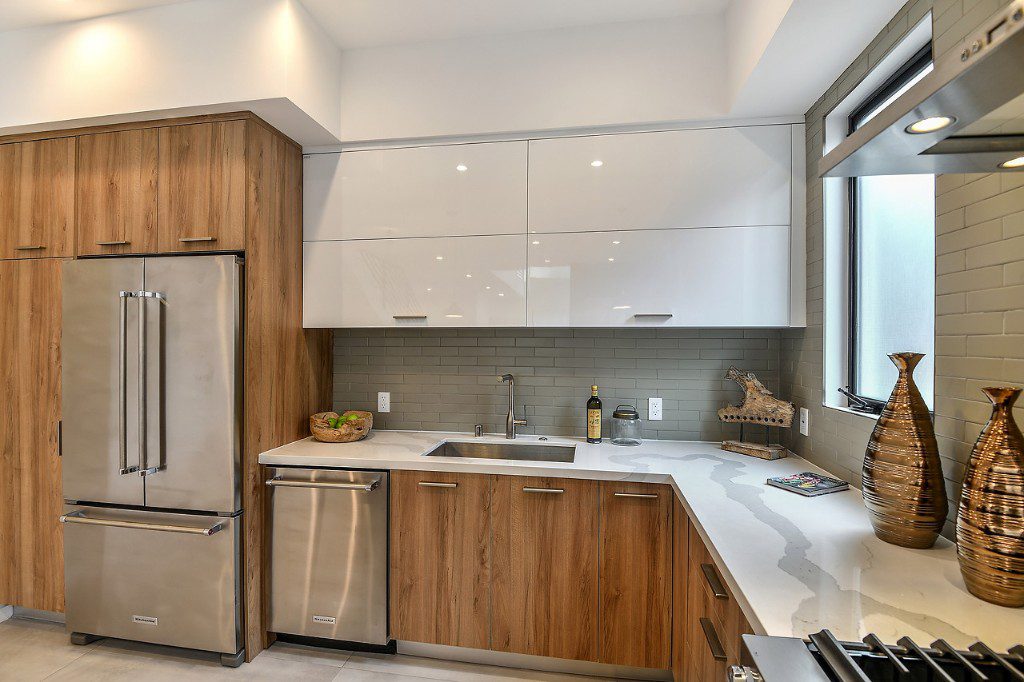 Sleek ivory cabinets in modern style kitchen