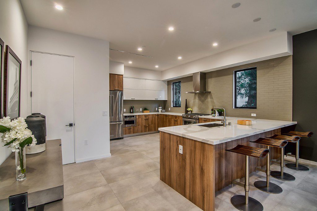 Los Angeles kitchen featuring elegant counterspace and bar