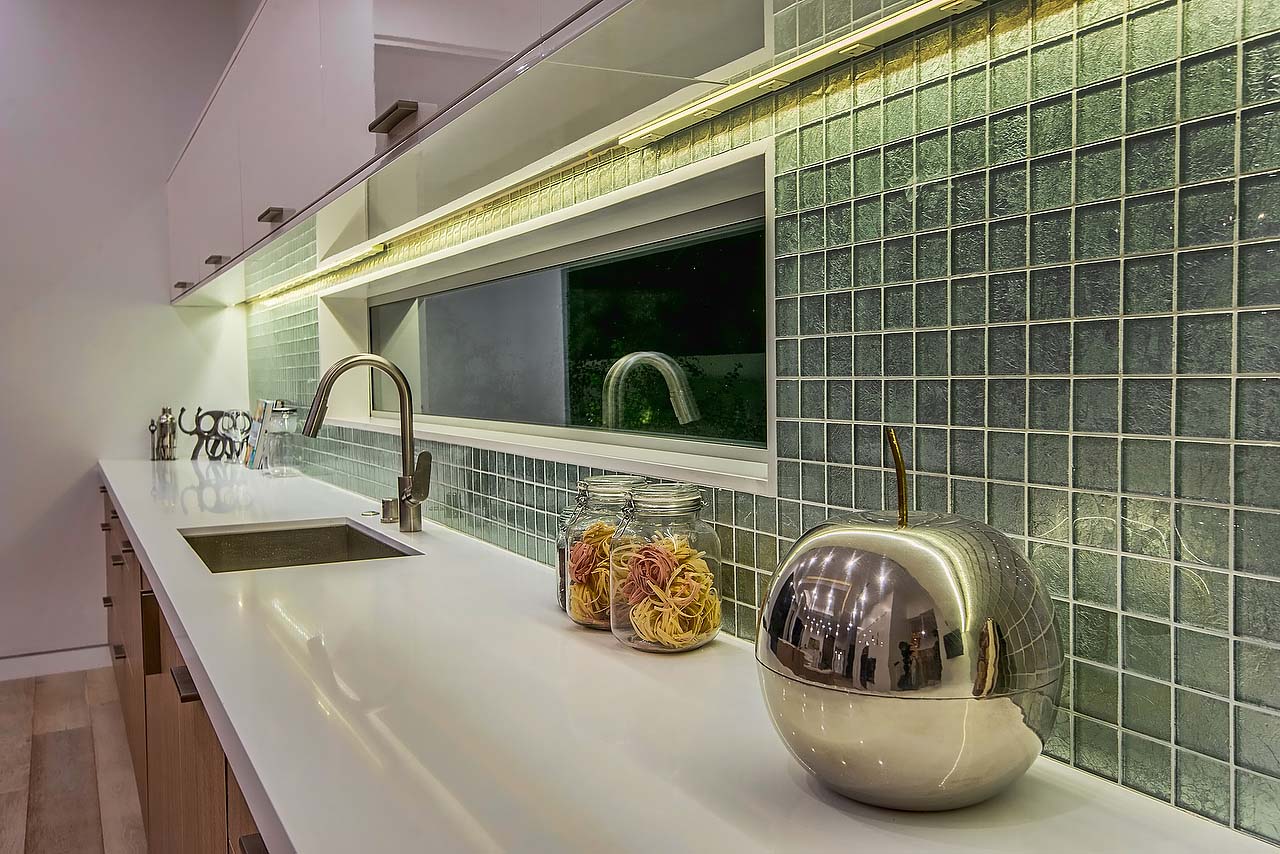 Small green tile backsplash in modern California kitchen