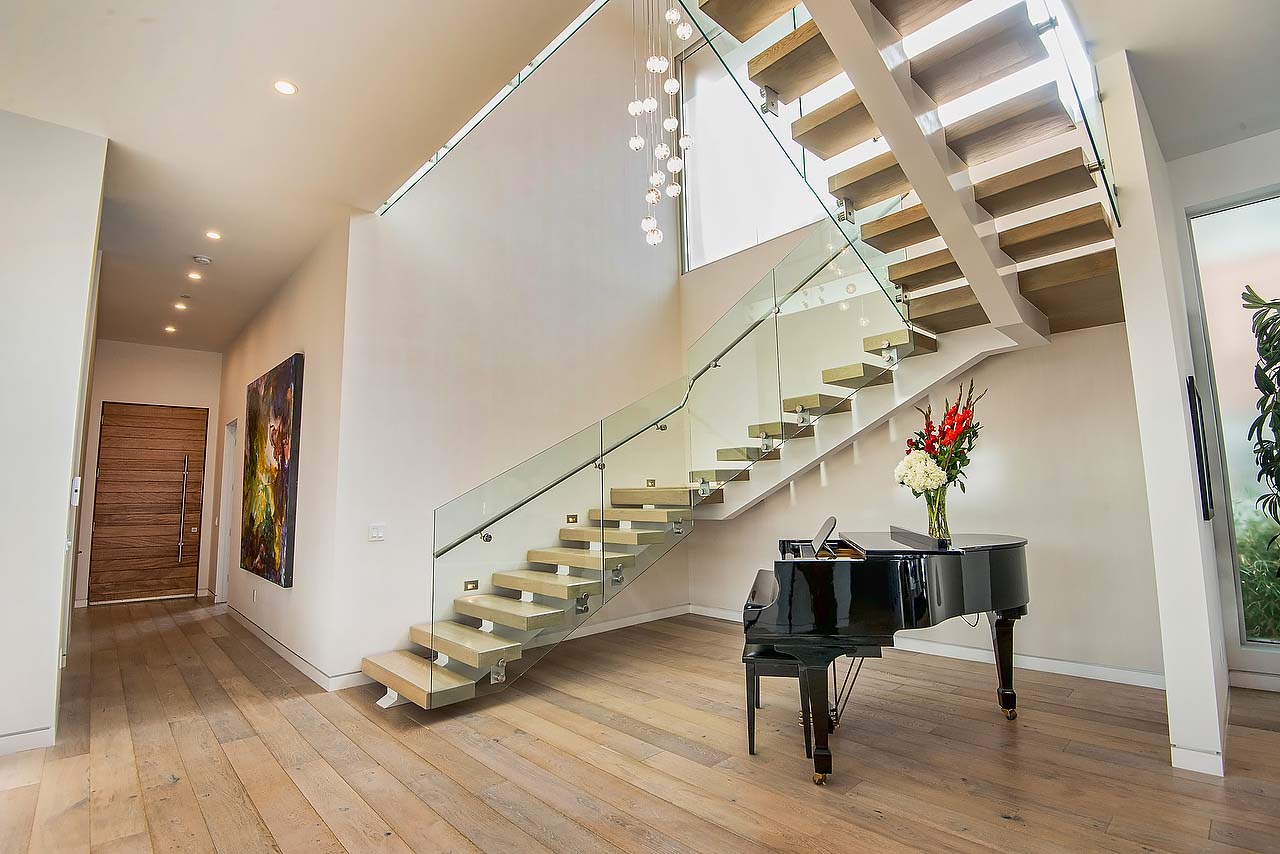 Grand staircase with glass siding in modern California home